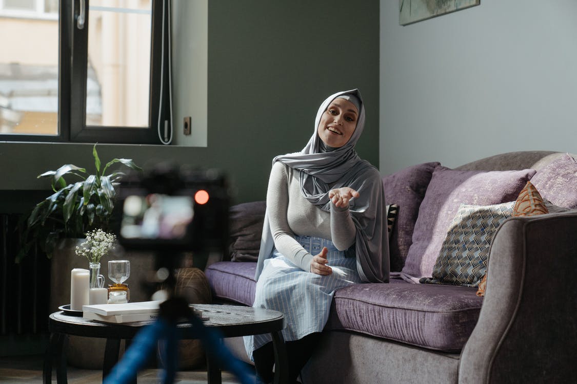 documentary filmmaking woman sitting on a couch being interviewed