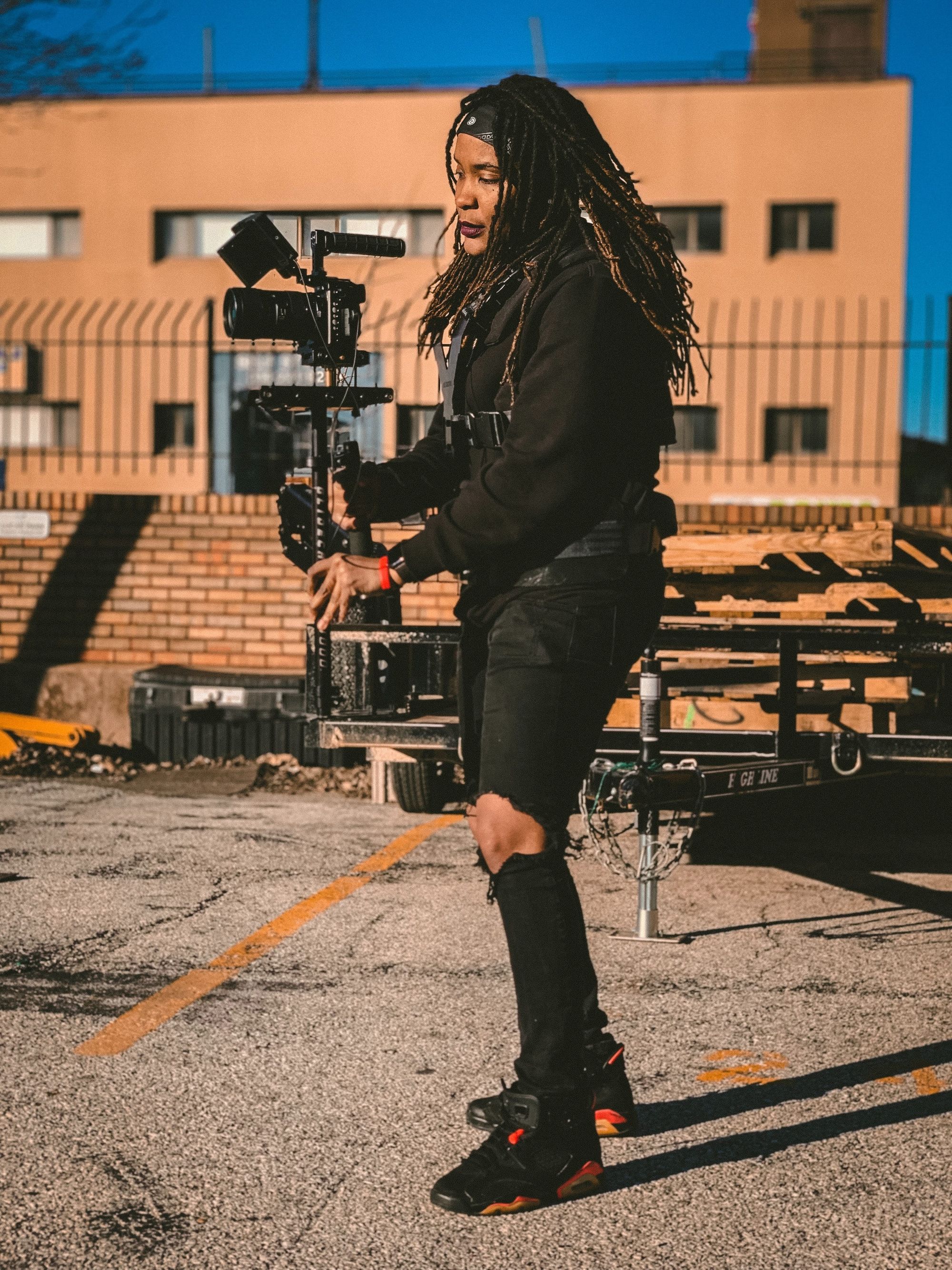 woman-holding-camera-while-filming-video