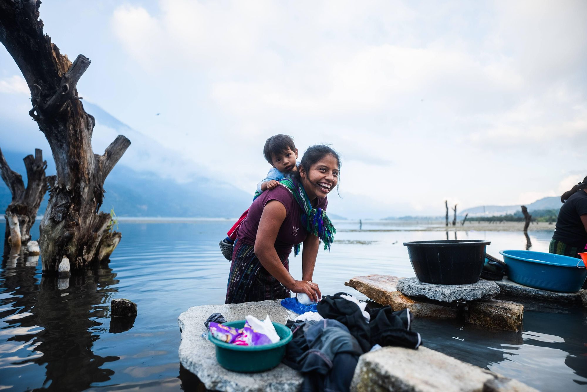 woman-with-child-working-at-shore