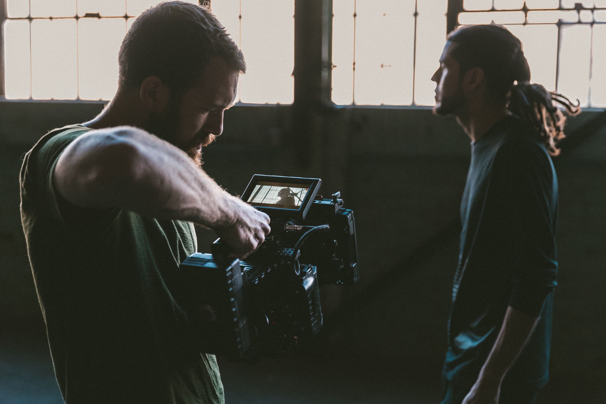 camera-man-filming-guy-in-building