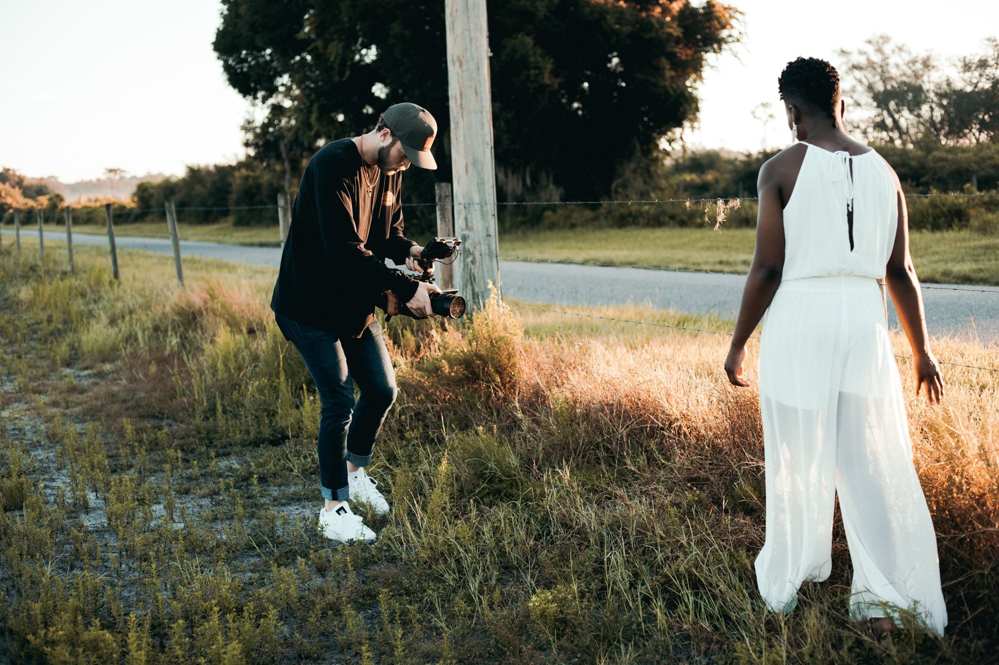 fashion-videographer-filming-woman-in-white-dress