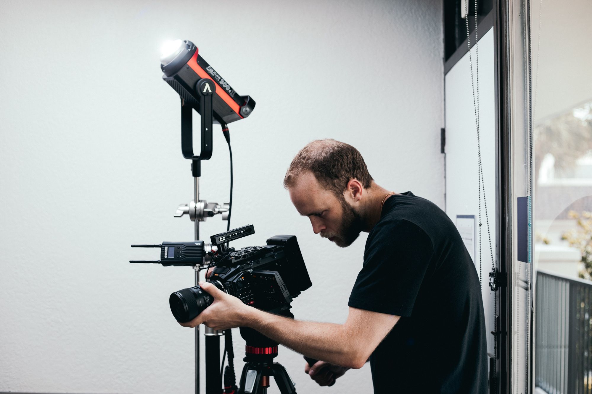 man-checking-camera-equipment