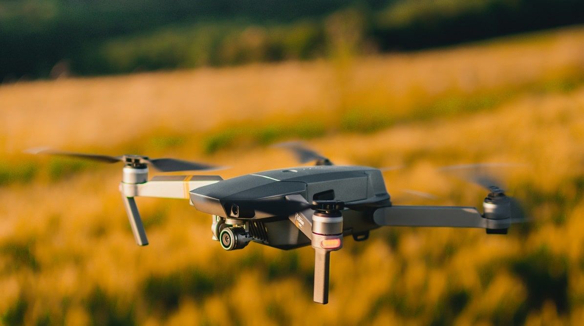 drone flying over field