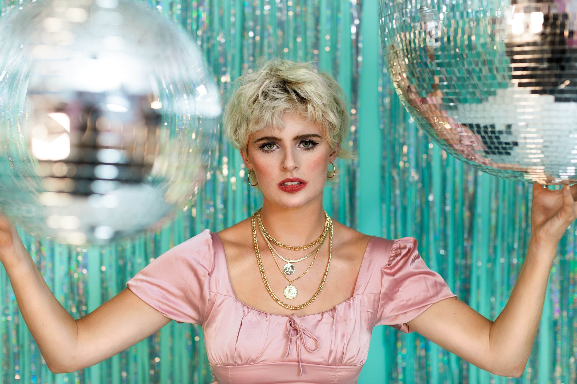 Editorial photo of model with disco balls