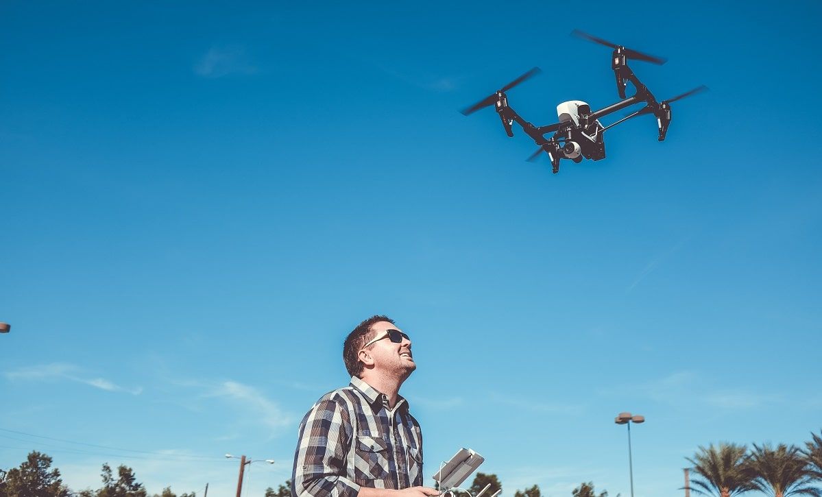 man flying drone