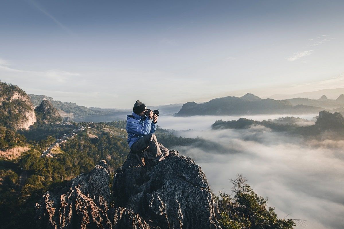 photographer on top of mountain