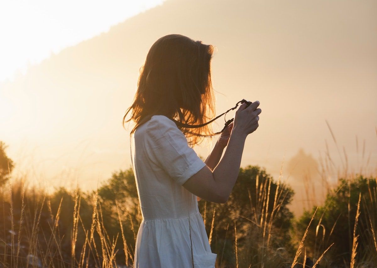 photographer standing in field