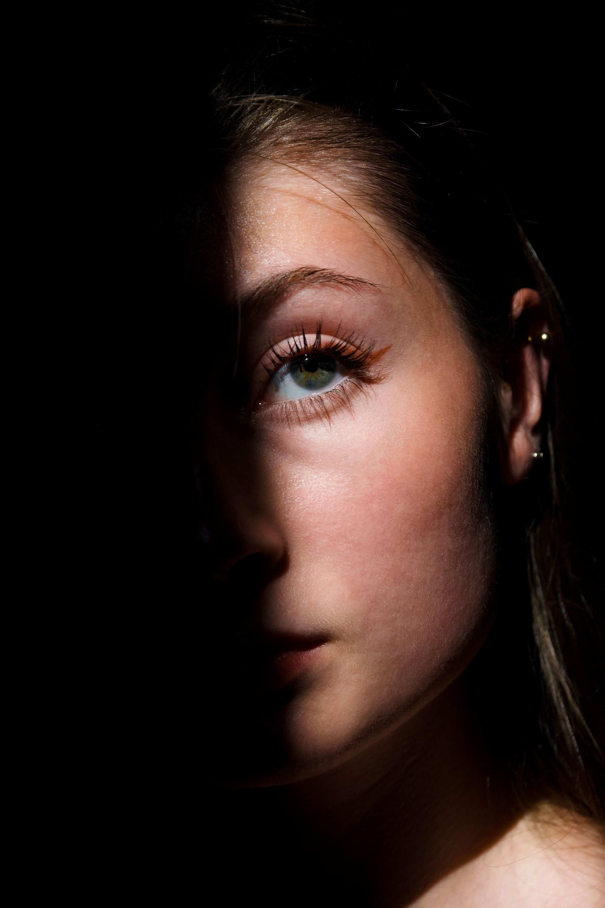 Half-lit face of woman