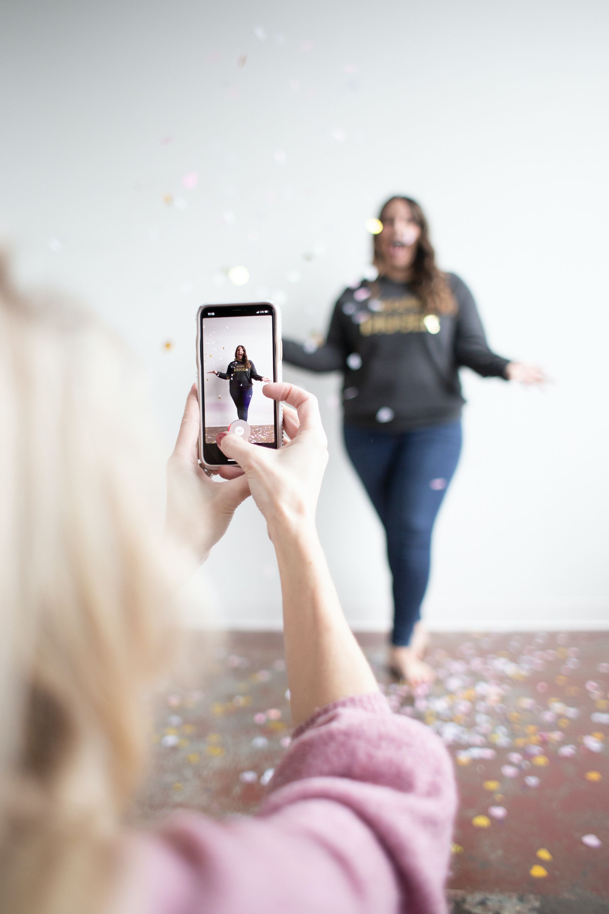 Recording a TIkTok with confetti.